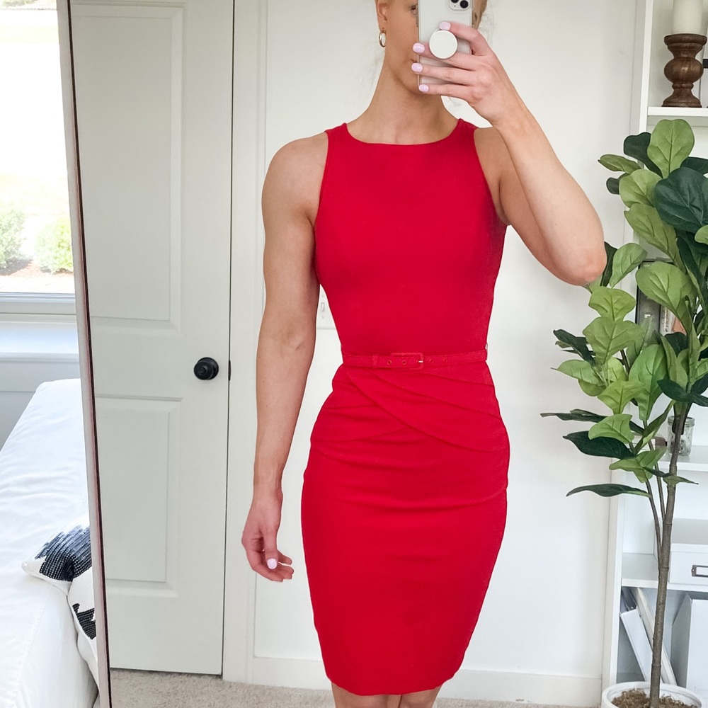 Form fitting red belted dress